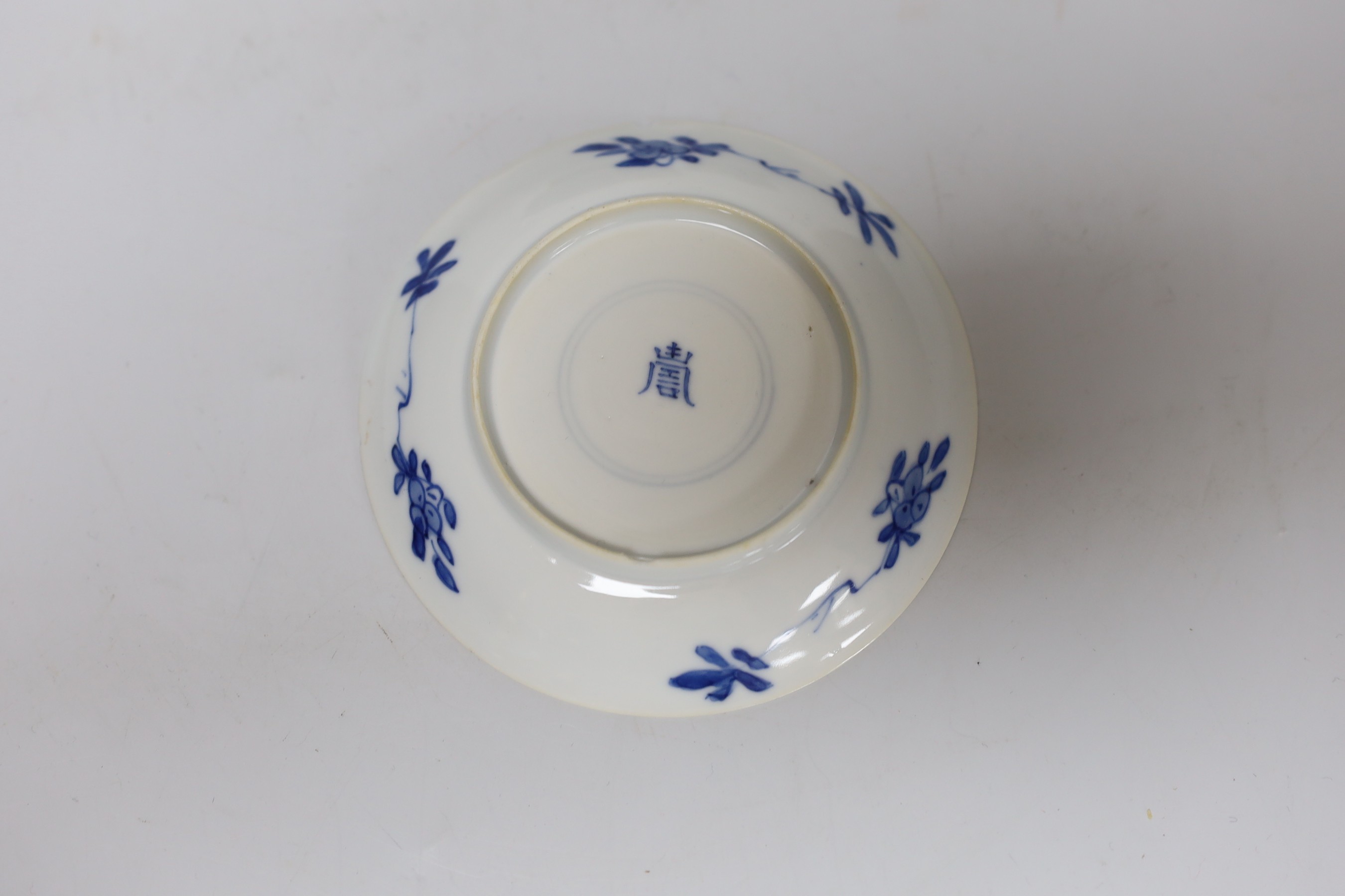 A Chinese Kangxi blue and white tea bowl and saucer, and a blue and white bowl, largest 13cm diameter